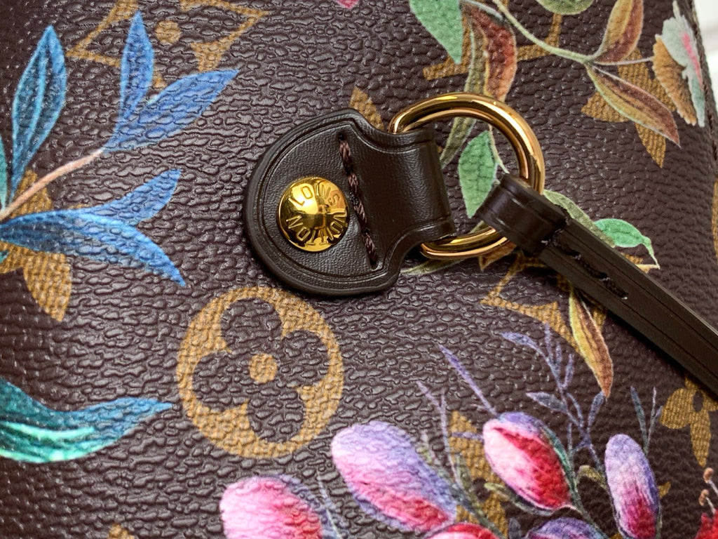 Leather key ring with gold LV coin charm on floral monogram tote