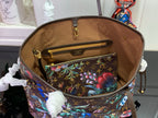Louis Vuitton bag open top showing brown lining and floral zip pocket interior