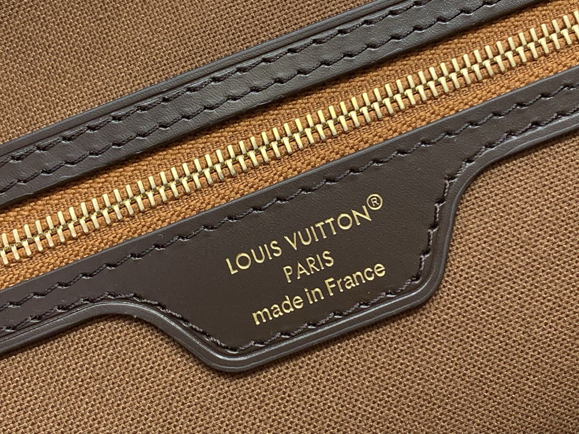 Louis Vuitton bag strap with logo plate and stitched edge, dark brown