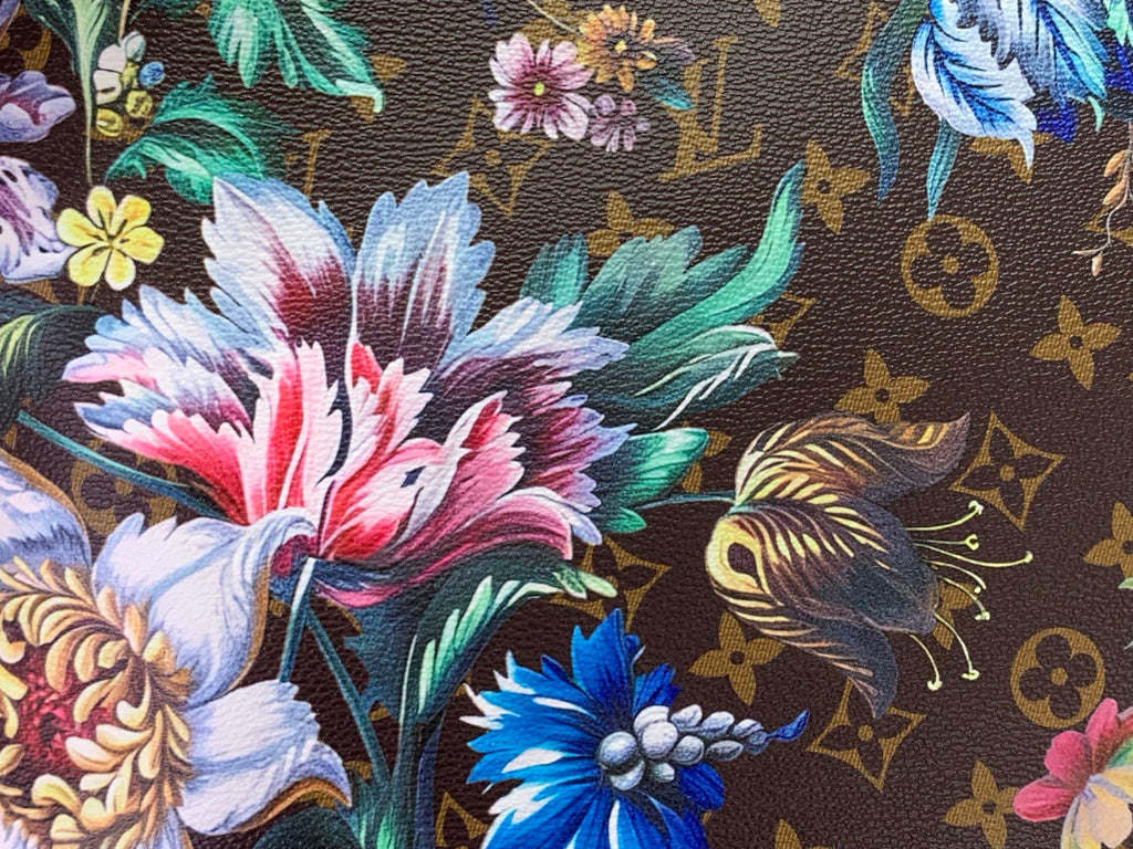 Floral patterned fabric panel on tote bag with brown monogram motifs