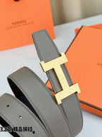 Grey leather belt with gold-tone H buckle and folded strap end