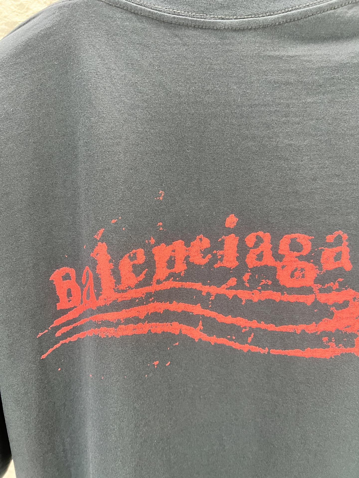 Balenciaga graphic T-shirt, heather gray, crew neck, close-up of red logo print
