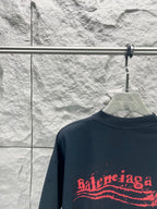 Balenciaga graphic T-shirt, dark navy, crew neck, close-up of red logo print