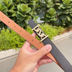 Black leather belt with gold-tone buckle and tan strap lining, side view