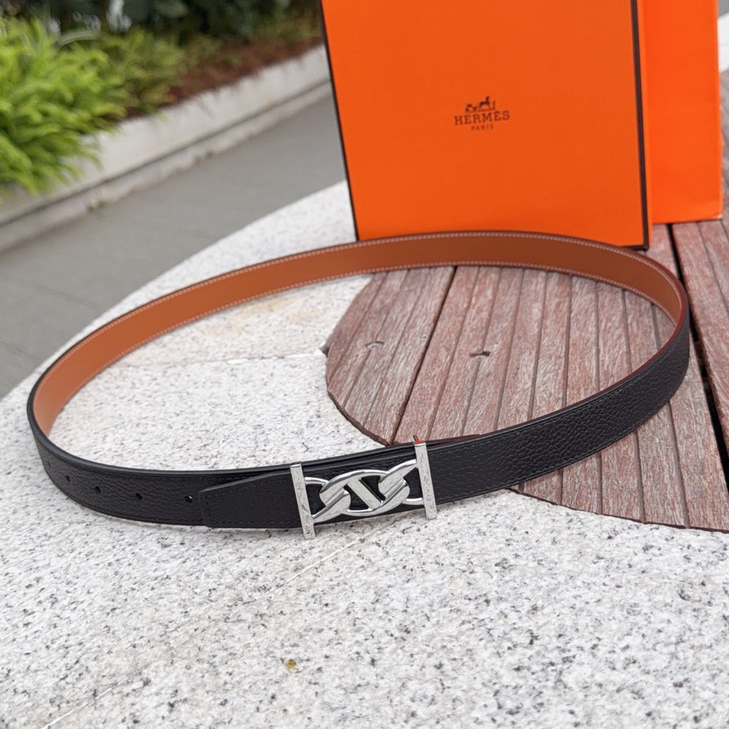 Black leather Hermes belt with silver-tone buckle and prong closure