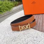 Hermes belt with tan leather strap and gold buckle; inner side shows dark lining