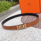 Hermes belt in tan leather with gold-toned buckle and single keeper, flat lay