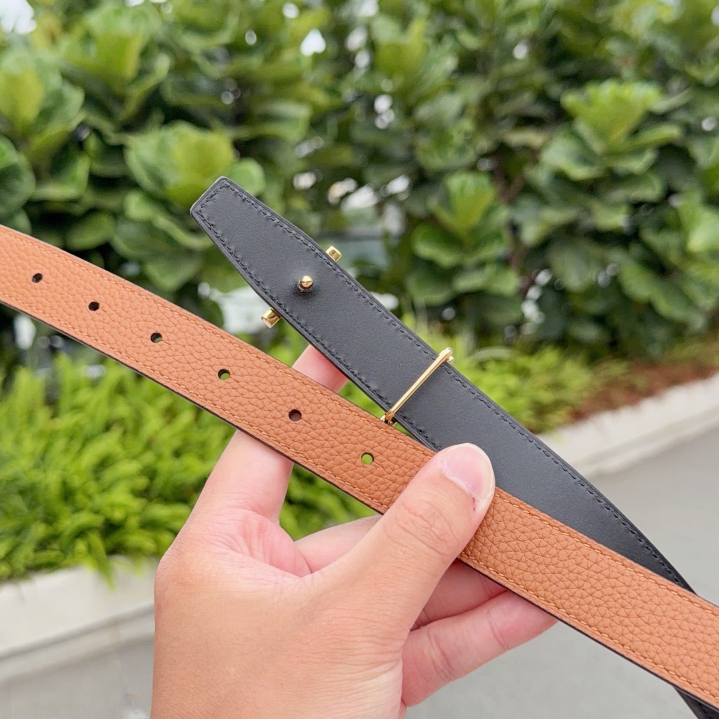 Hermes reversible belt: tan side and dark side with metal buckle and adjustment holes