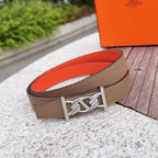 Leather belt with tan textured strap and silver buckle with keeper loop