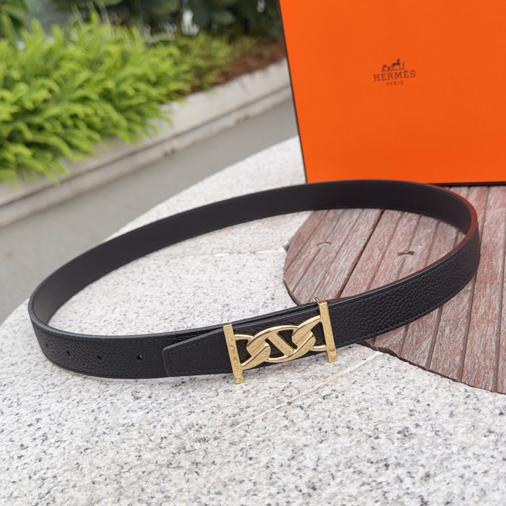 Leather belt with black strap and gold-toned buckle clasp