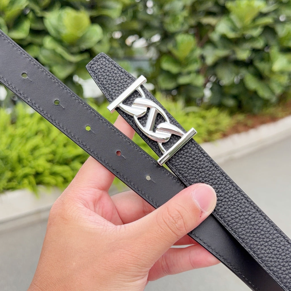 Hermes black leather belt strap detail with punched holes and silver-tone buckle