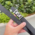 Hermes black leather belt strap detail with punched holes and silver-tone buckle
