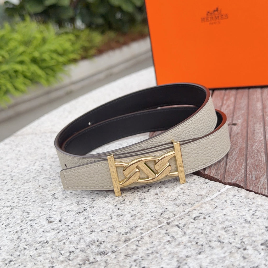 Beige leather belt with gold-tone buckle and dark interior side