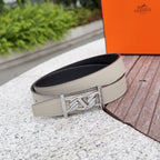 Hermes leather belt in light beige with silver buckle on dark underside