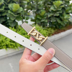 Leather belt in off-white with gold buckle and punched adjustment holes