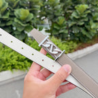 Reversible Hermes leather belt with taupe and white sides, silver-tone H buckle.