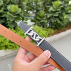 Dark gray leather belt with silver buckle and white stitching; tan belt underside