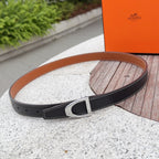 Hermes belt in dark leather with silver buckle, tan underside stitching detail