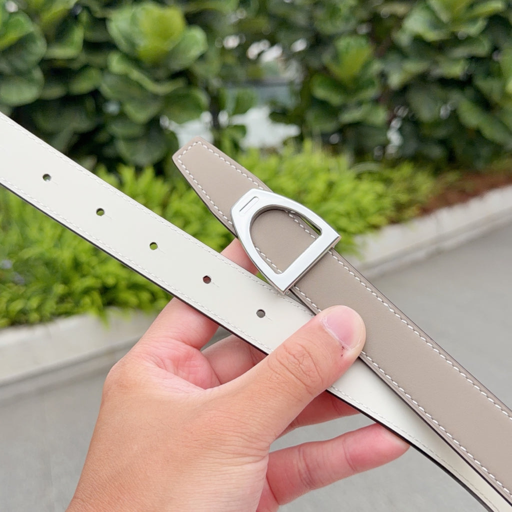 Hermes belt with light taupe front, white back, and silver-tone buckle detail