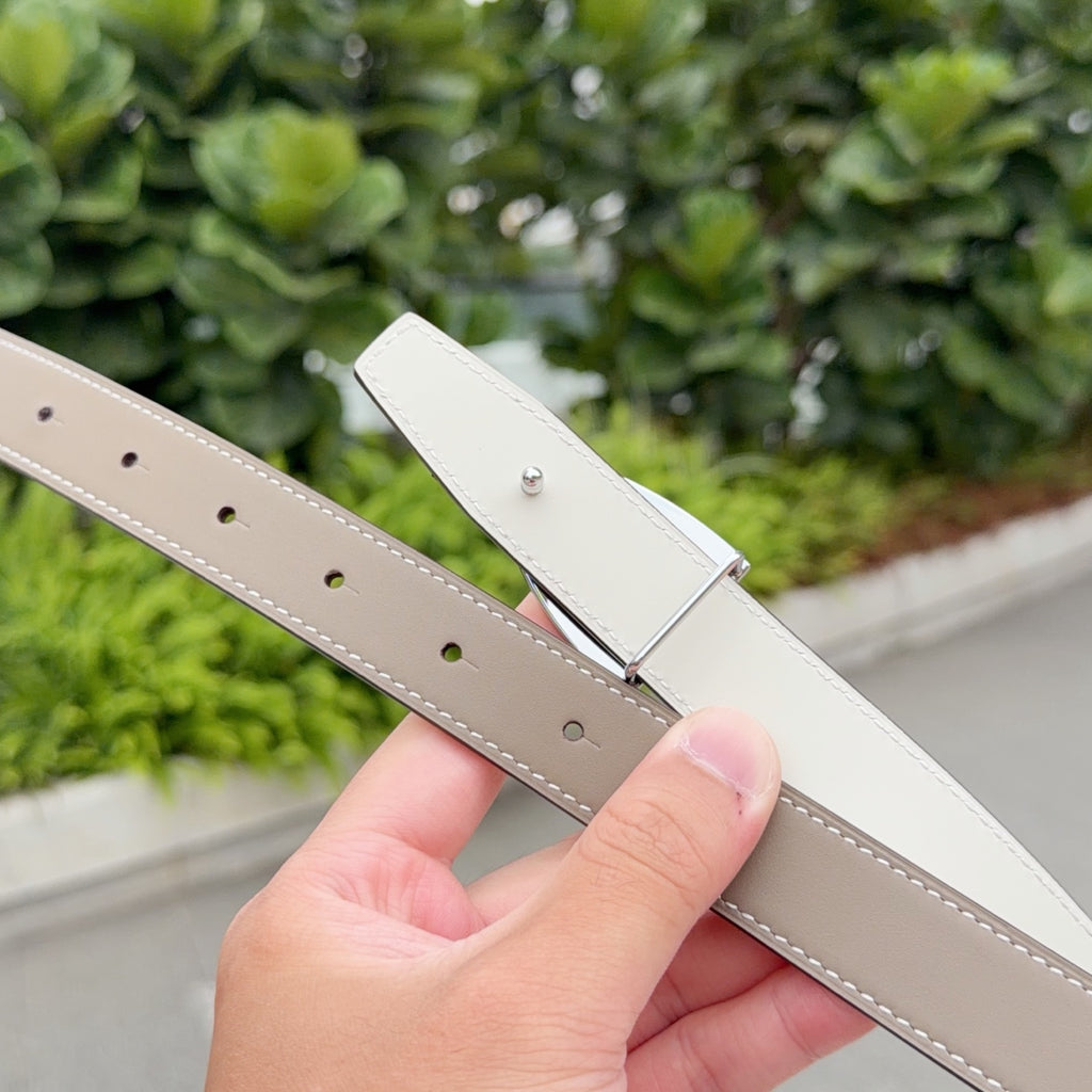 Hermes belt close-up of light taupe strap holes with white underside