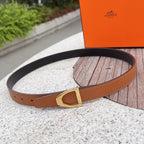 Hermes belt in tan leather with gold buckle and punched holes on strap.