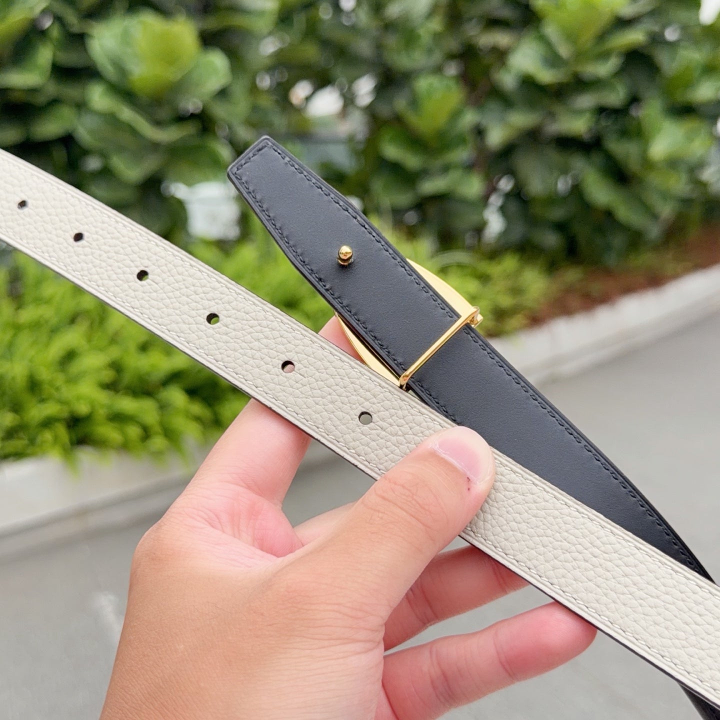 Two-tone leather belt with gold-tone buckle, beige strap and dark strap