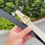 Two-tone leather belt with gold buckle and hole rows, beige and dark underside