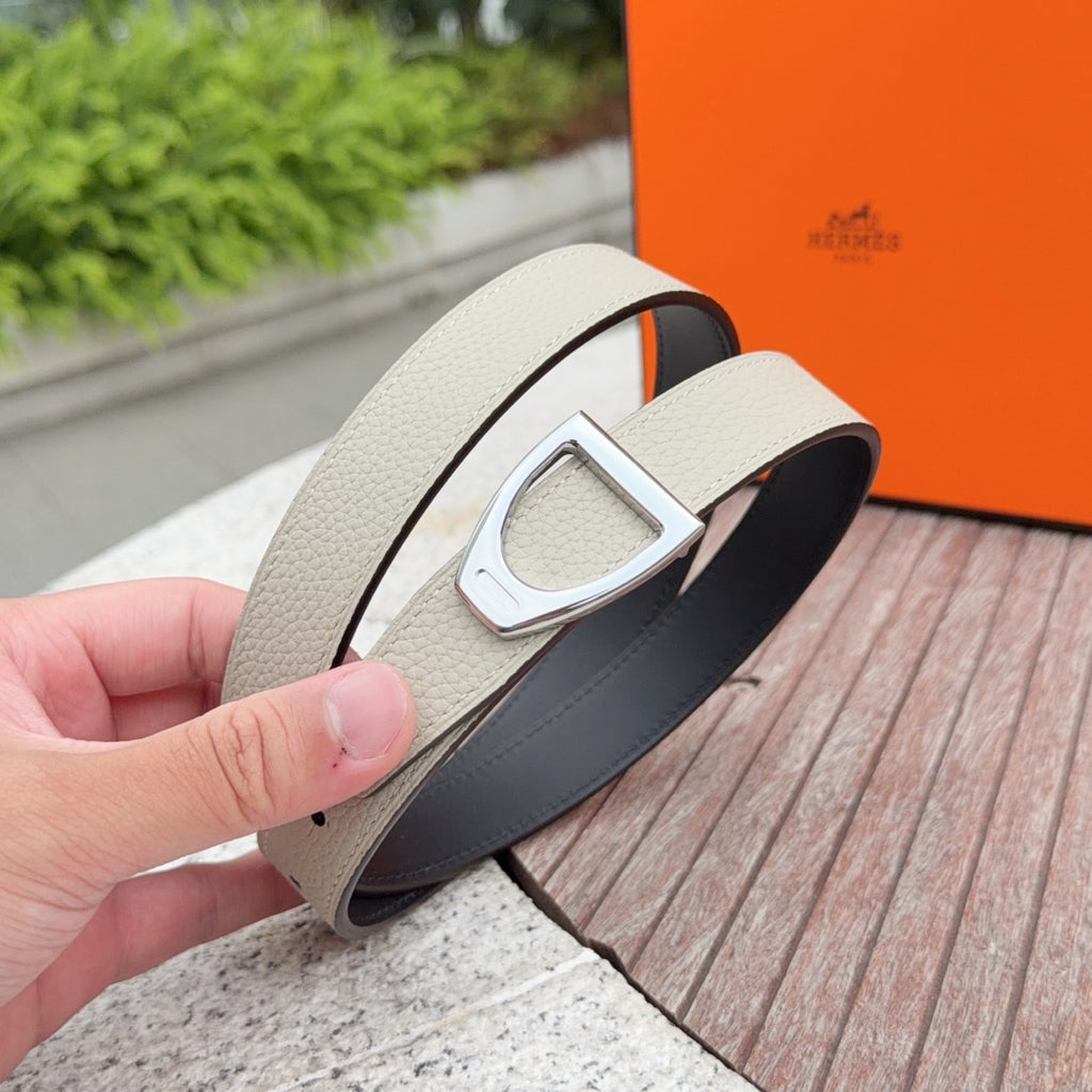Light beige leather belt with silver D-buckle and dark back strap