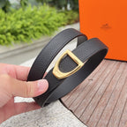 Black leather belt with textured grain and gold-tone square buckle
