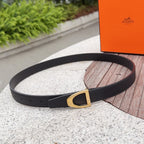 Black leather belt with gold-tone rectangular buckle and punched holes