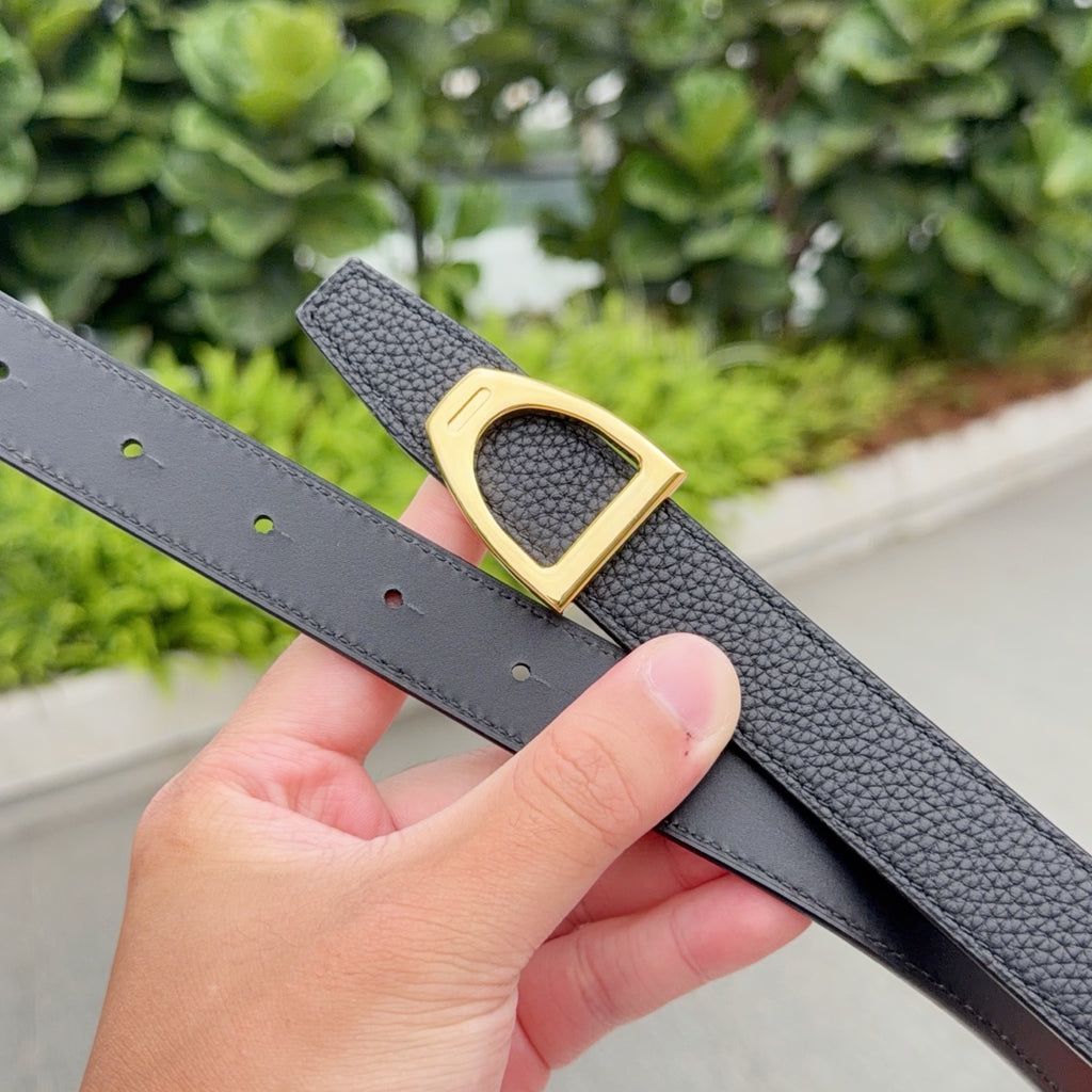 Black textured leather belt with gold-tone buckle and punched eyelets