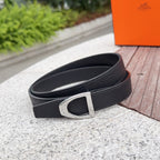 Black leather belt with silver buckle, shown from the side