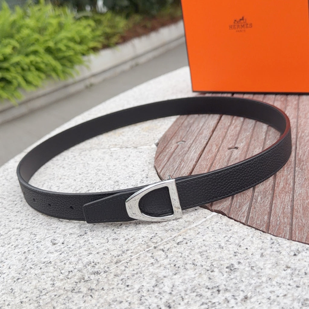 Black leather belt with silver-toned buckle and textured strap