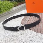 Black leather belt with silver-toned buckle and textured strap