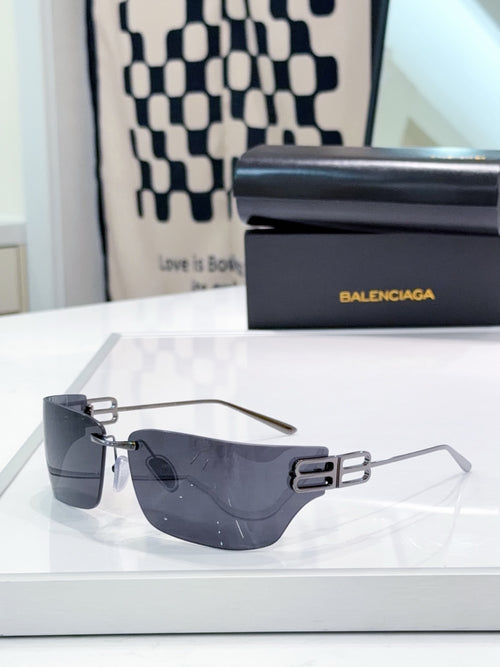 Balenciaga glasses with dark navy tinted lenses and silver-tone frame