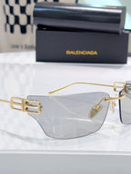 Balenciaga glasses with clear lenses and gold-tone frame, front view