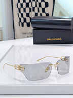 Balenciaga glasses with clear lenses and gold-tone frame
