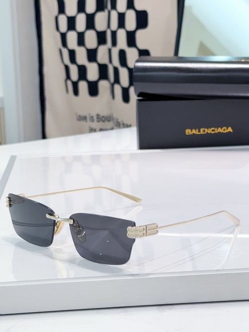 Gold-tone rectangular sunglasses with dark lenses and metal temple detail