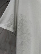Balenciaga T-shirt, light gray fabric close-up with stitched hem and sleeve