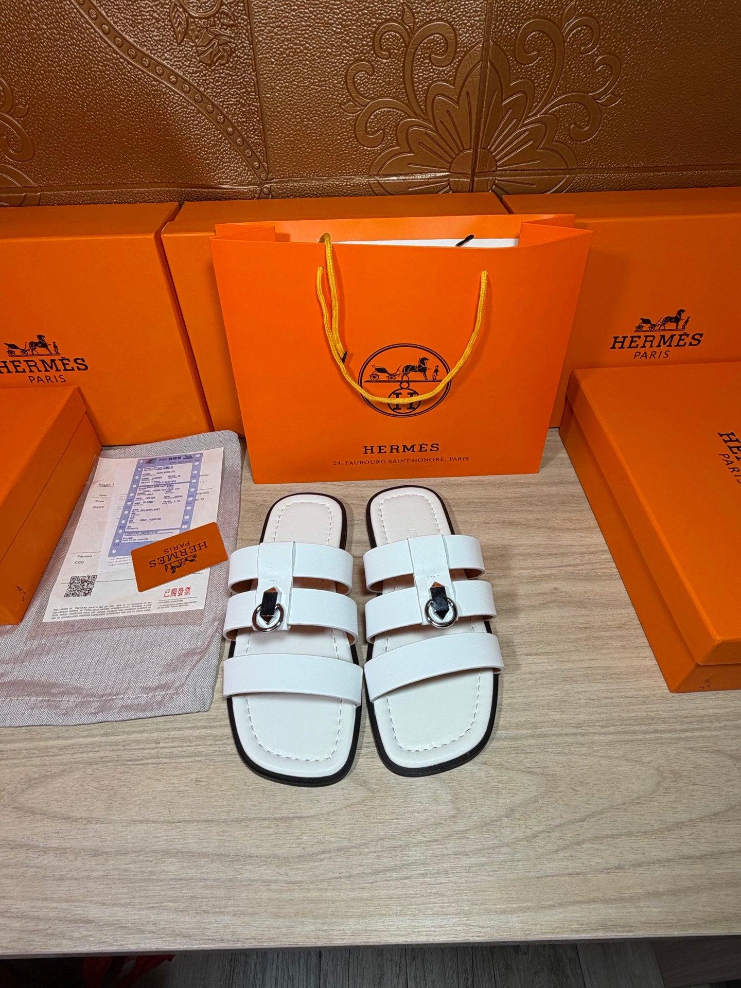 Hermes white leather slide sandals with double straps and silver buckle