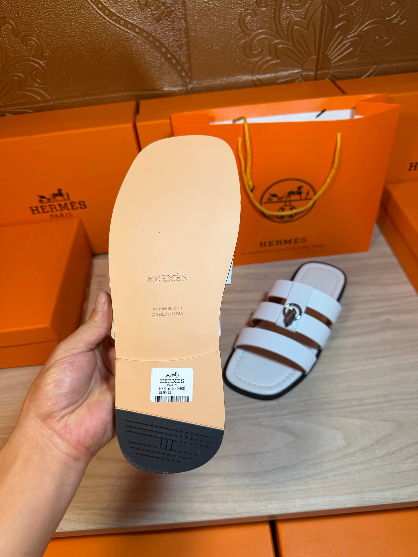 Hermes white leather slide sandal sole, textured rubber base and brand markings