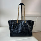 YSL quilted leather tote bag with gold chain handles and centered front YSL logo