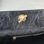 YSL quilted leather bag with gold logo ring and top zipper hardware