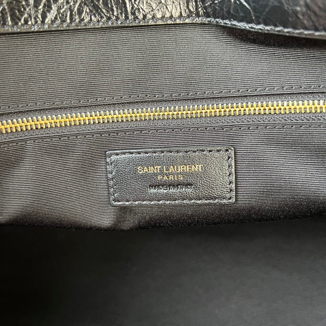 YSL SAINT LAURENT PARIS label on interior lining near zipper