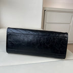 YSL black quilted leather clutch bag with gold logo hardware