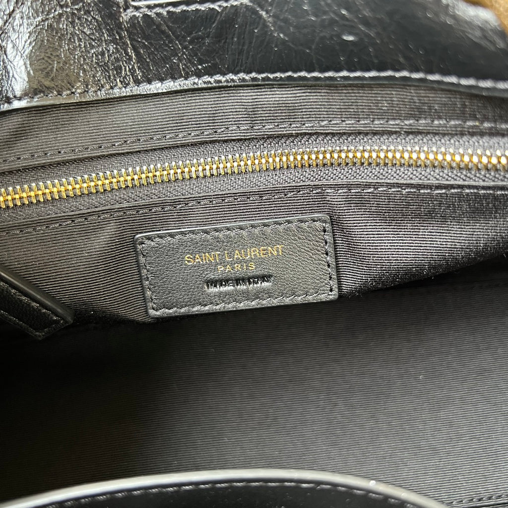 Black fabric-lined tote interior with SAINT LAURENT PARIS label and gold zipper
