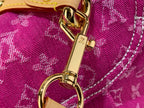 Louis Vuitton fuchsia monogram fabric with gold hook and ring hardware detail