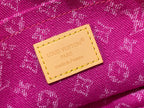 Louis Vuitton fuchsia monogram bag label on stitched leather patch