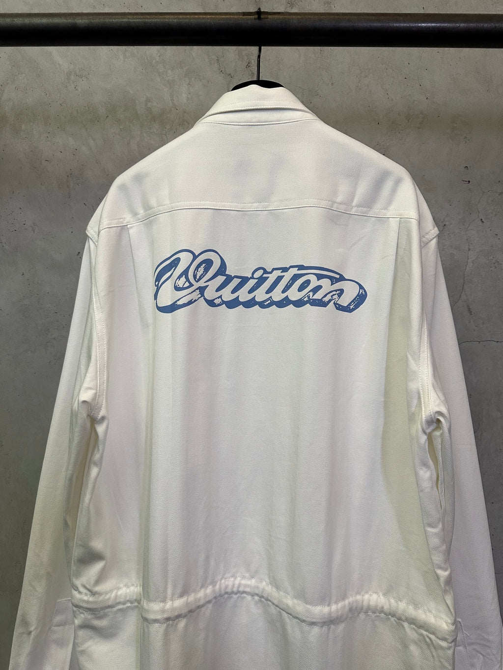 White long-sleeve jacket with large blue back logo