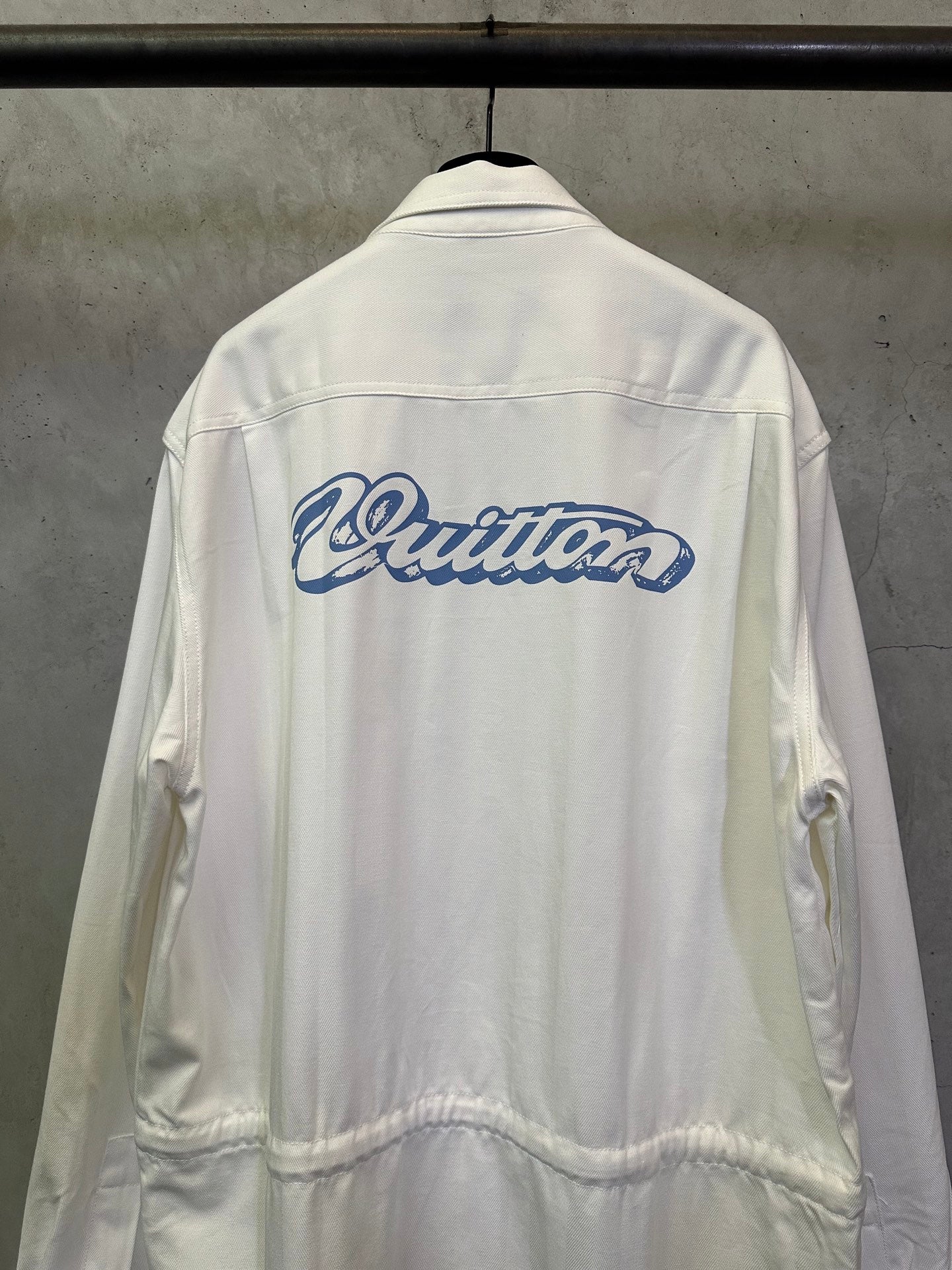 White long-sleeve jacket with large blue back logo